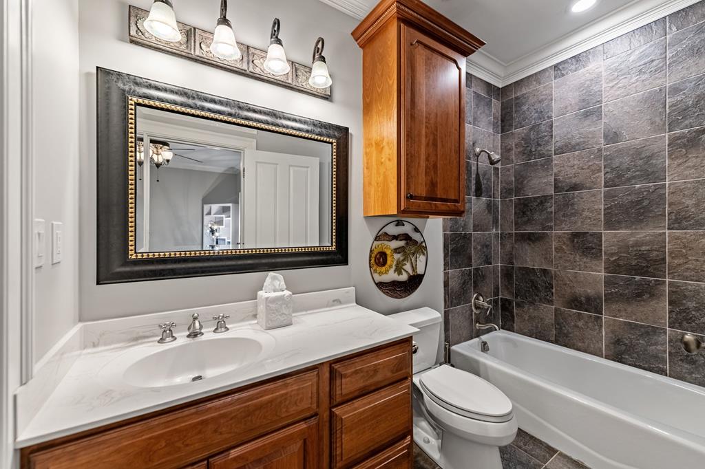640 A J Land Road Canton, GA 30115 - Photo 66 of 94 a bathroom with a sink a toilet and a bathtub