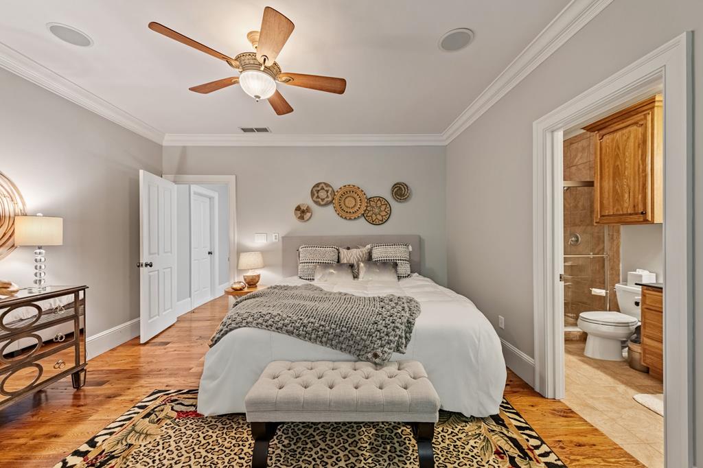 640 A J Land Road Canton, GA 30115 - Photo 67 of 94 a bedroom with a bed and dresser with wooden floor