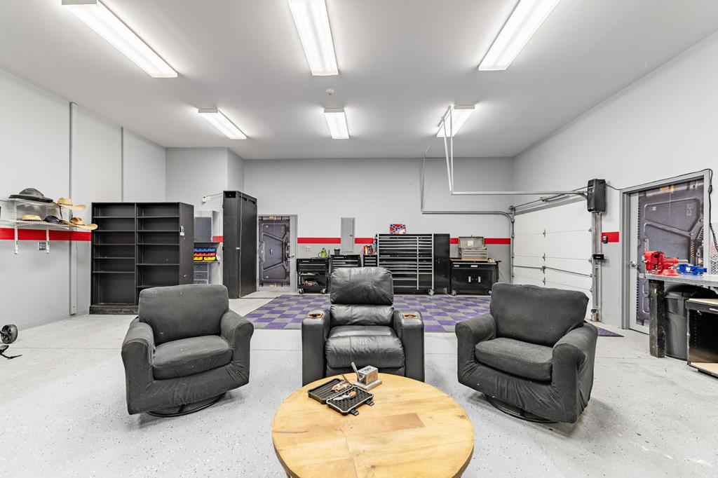 640 A J Land Road Canton, GA 30115 - Photo 84 of 94 a living room with furniture and a flat screen tv