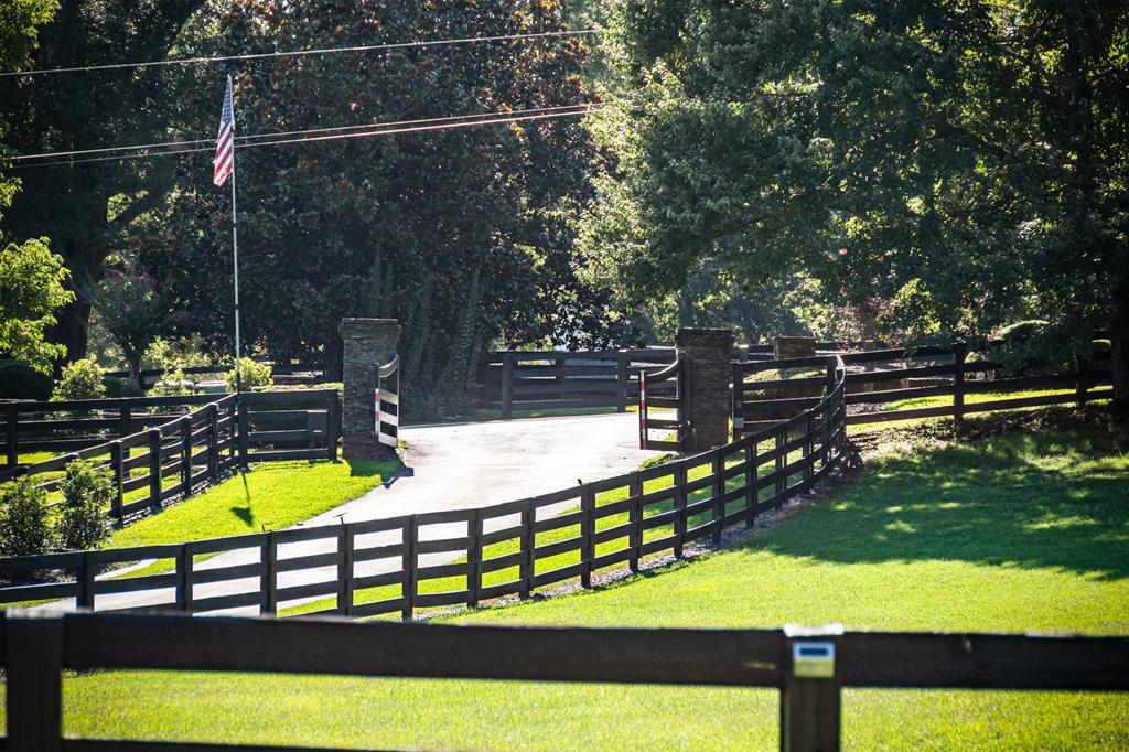 640 A J Land Road Canton, GA 30115 - Photo 94 of 94 a view of a swimming pool with a bench and trees