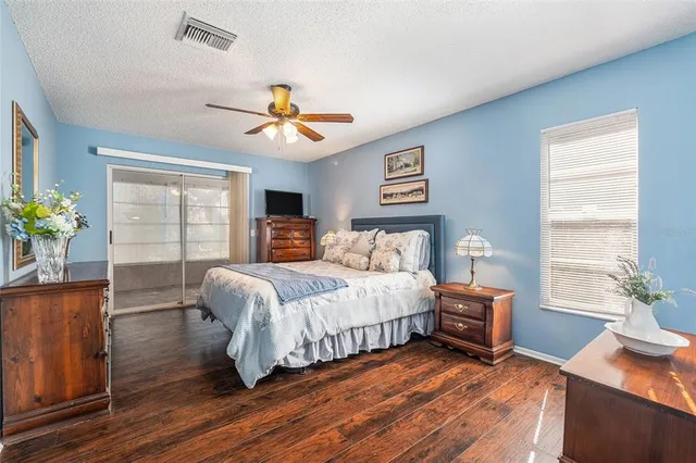 a bedroom with bed and window