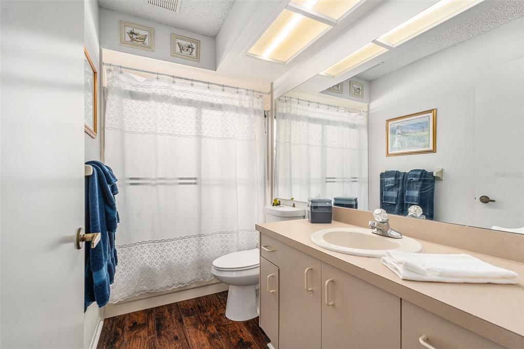 4636 Portland Manor Drive New Port Richey, FL 34655 - Photo 25 of 37 a bathroom with a granite countertop sink toilet and shower