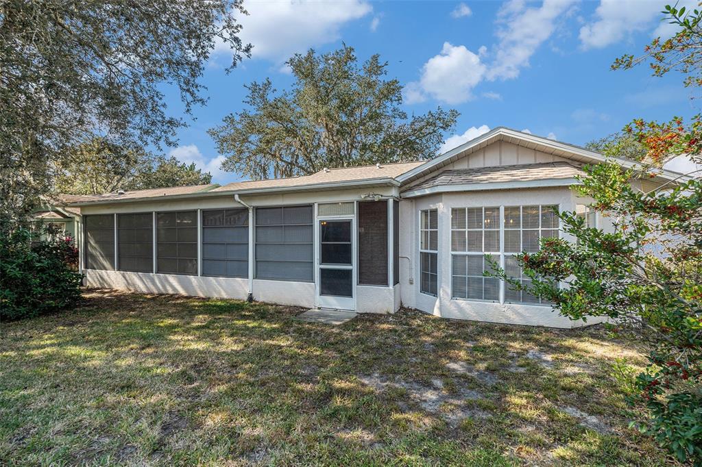 4636 Portland Manor Drive New Port Richey, FL 34655 - Photo 28 of 37 a front view of a house with a garden