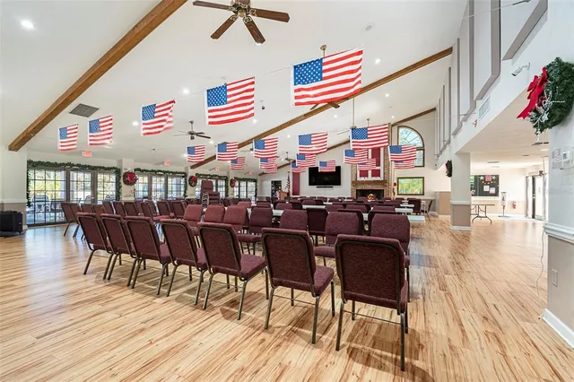 a dinning area with furniture wooden floor and flat screen tv