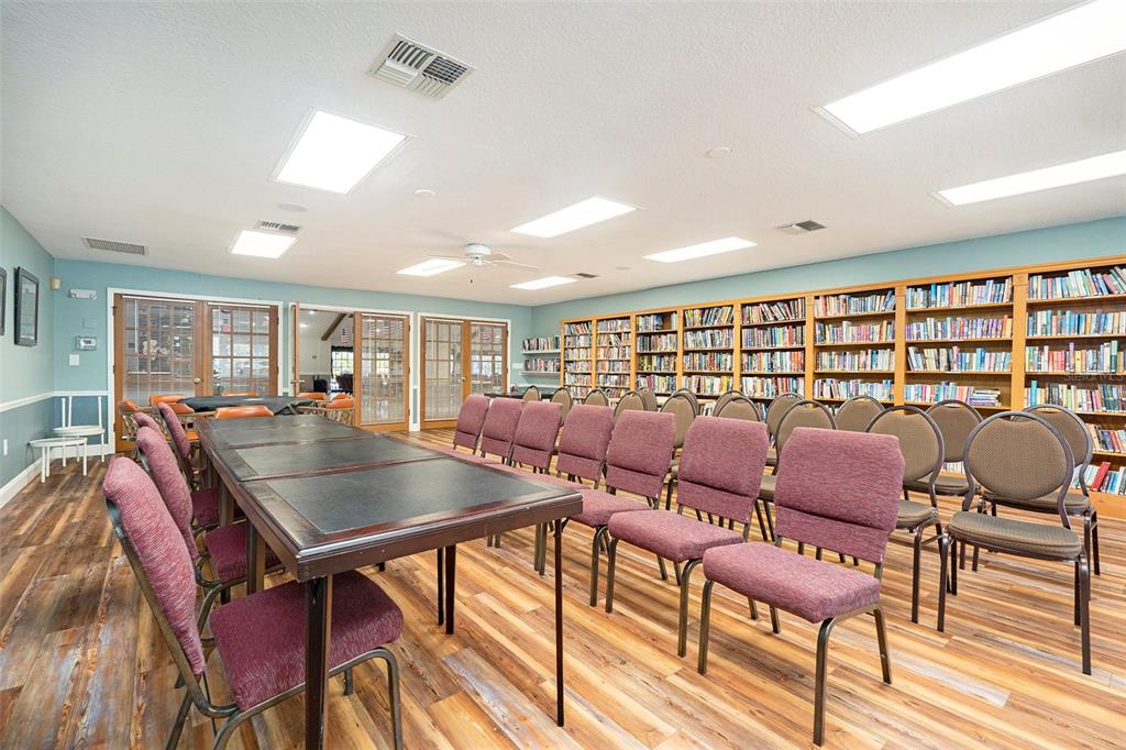 4636 Portland Manor Drive New Port Richey, FL 34655 - Photo 33 of 37 a room with lots of chairs and wooden floor