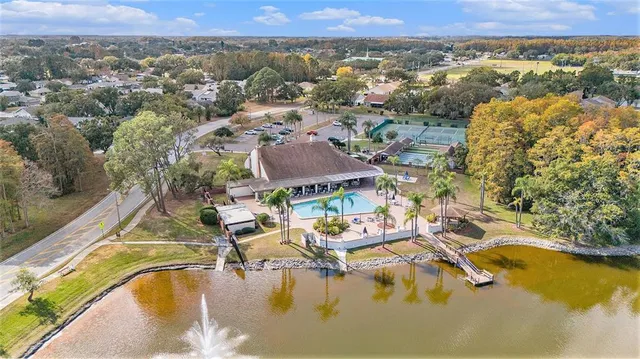 an aerial view of residential house with outdoor space and swimming pool