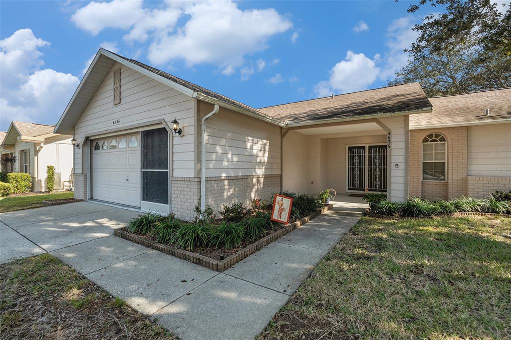 4636 Portland Manor Drive New Port Richey, FL 34655 - Photo 5 of 37 a front view of house with yard