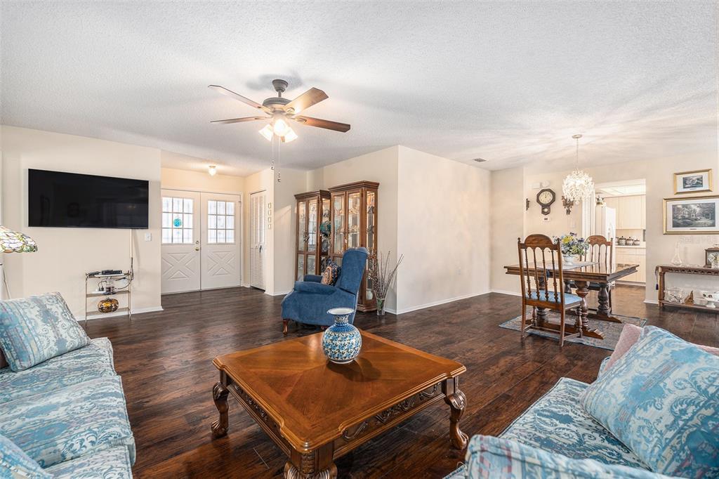 4636 Portland Manor Drive New Port Richey, FL 34655 - Photo 7 of 37 a living room with furniture and a flat screen tv