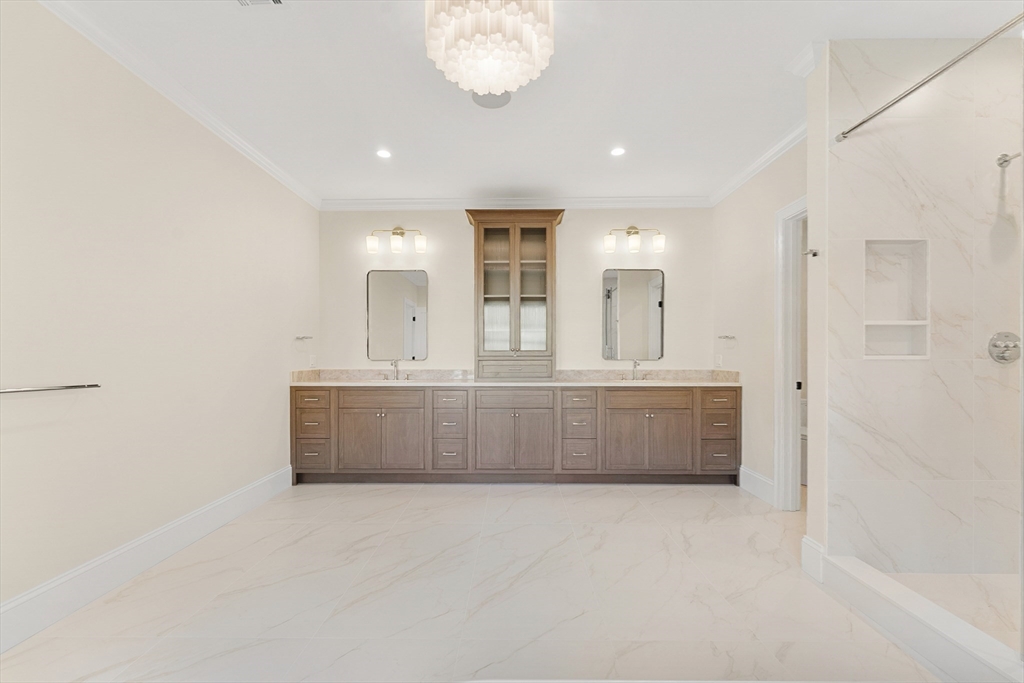 1266 South Street Needham, MA 02492 - Photo 20 of 32 a bathroom with a tub a sink and mirror