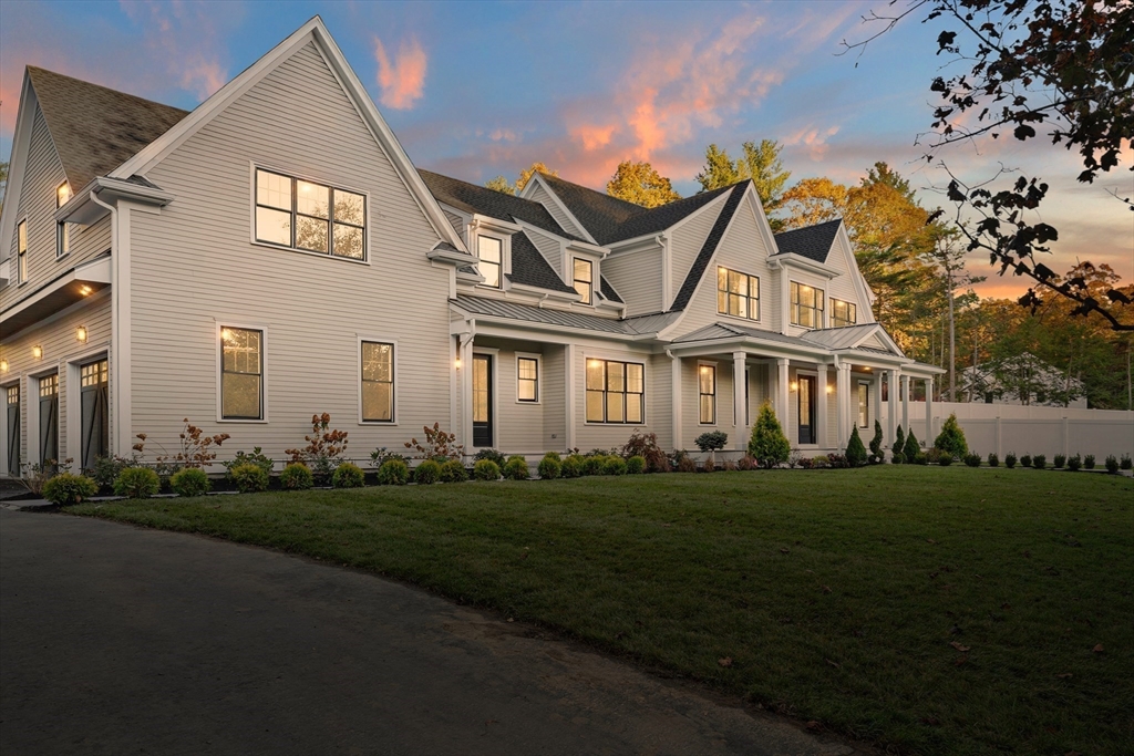 1266 South Street Needham, MA 02492 - Photo 29 of 32 a front view of a house with a garden