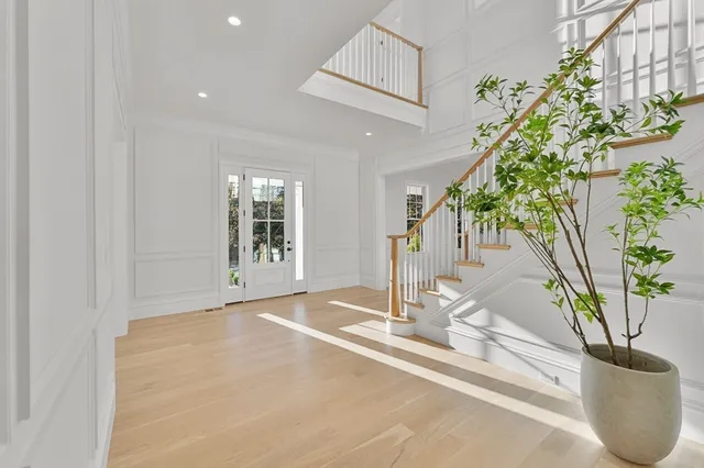 a view of a livingroom with furniture and a potted plant