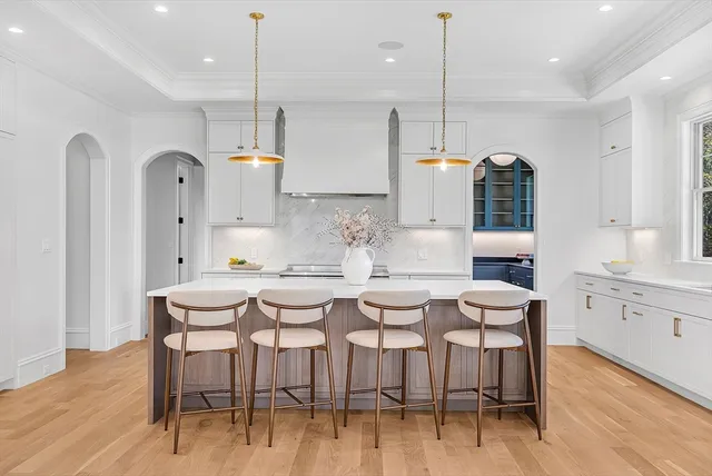 a living room with furniture a fireplace and a table