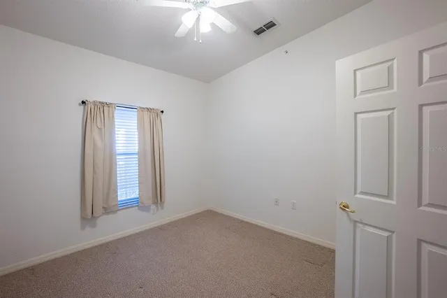 a room with a sink and a microwave