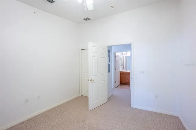 a view of a balcony with a ceiling fan