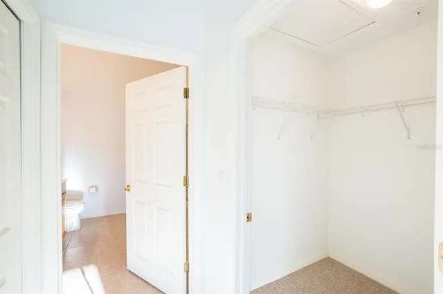 a very nice looking dining room with a large window and dining table
