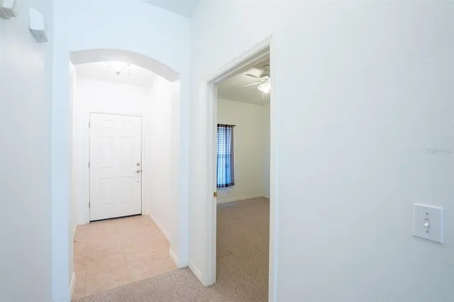 a view of a swimming pool with an outdoor seating and a yard