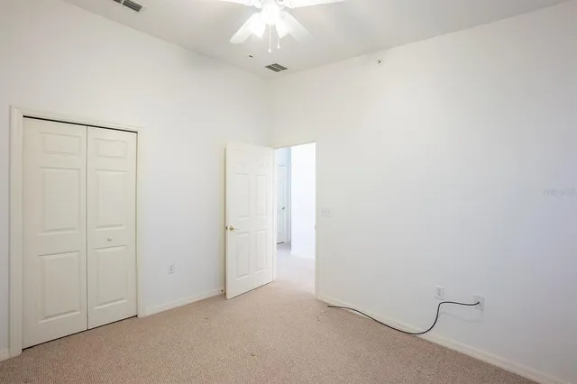 a bathroom with a double vanity sink toilet and a mirror