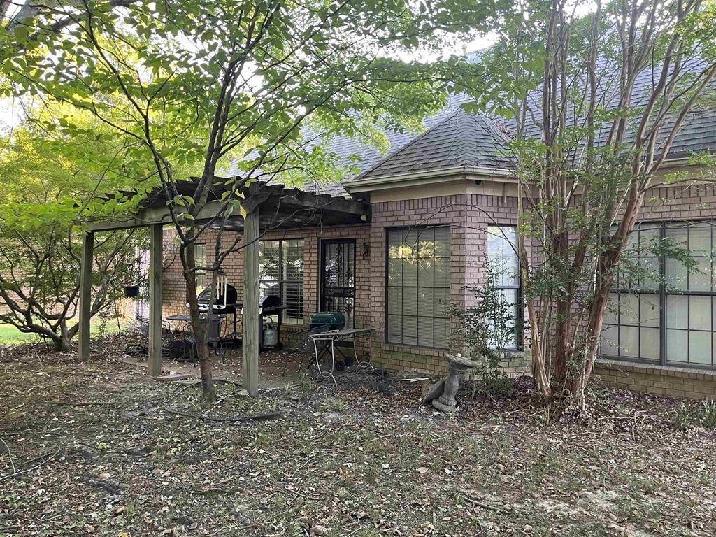 4066 Canada Road Lakeland, TN 38002 - Photo 3 of 5 a front view of a house with garden