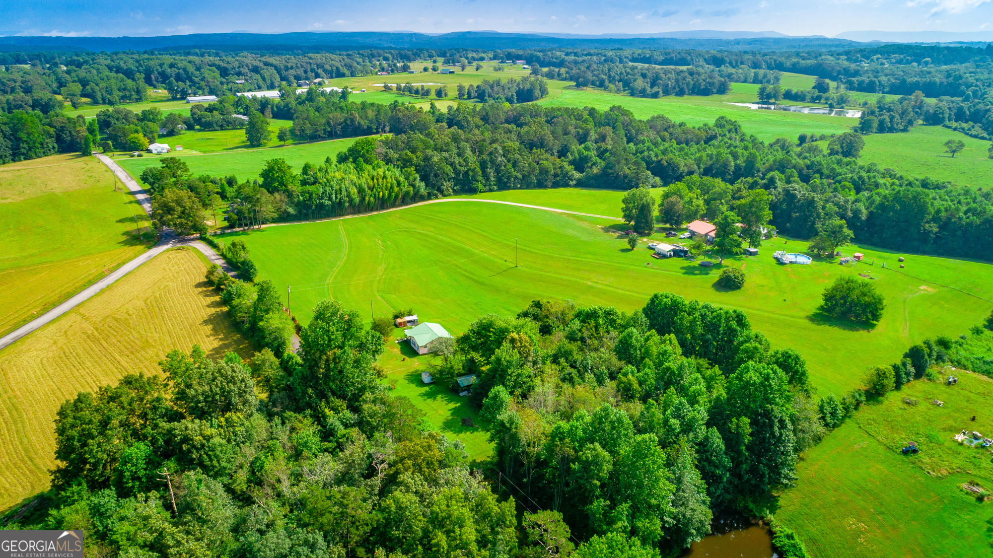77 Bolton Road Trenton, GA 30752 - Photo 12 of 47 a view of a city with lush green forest