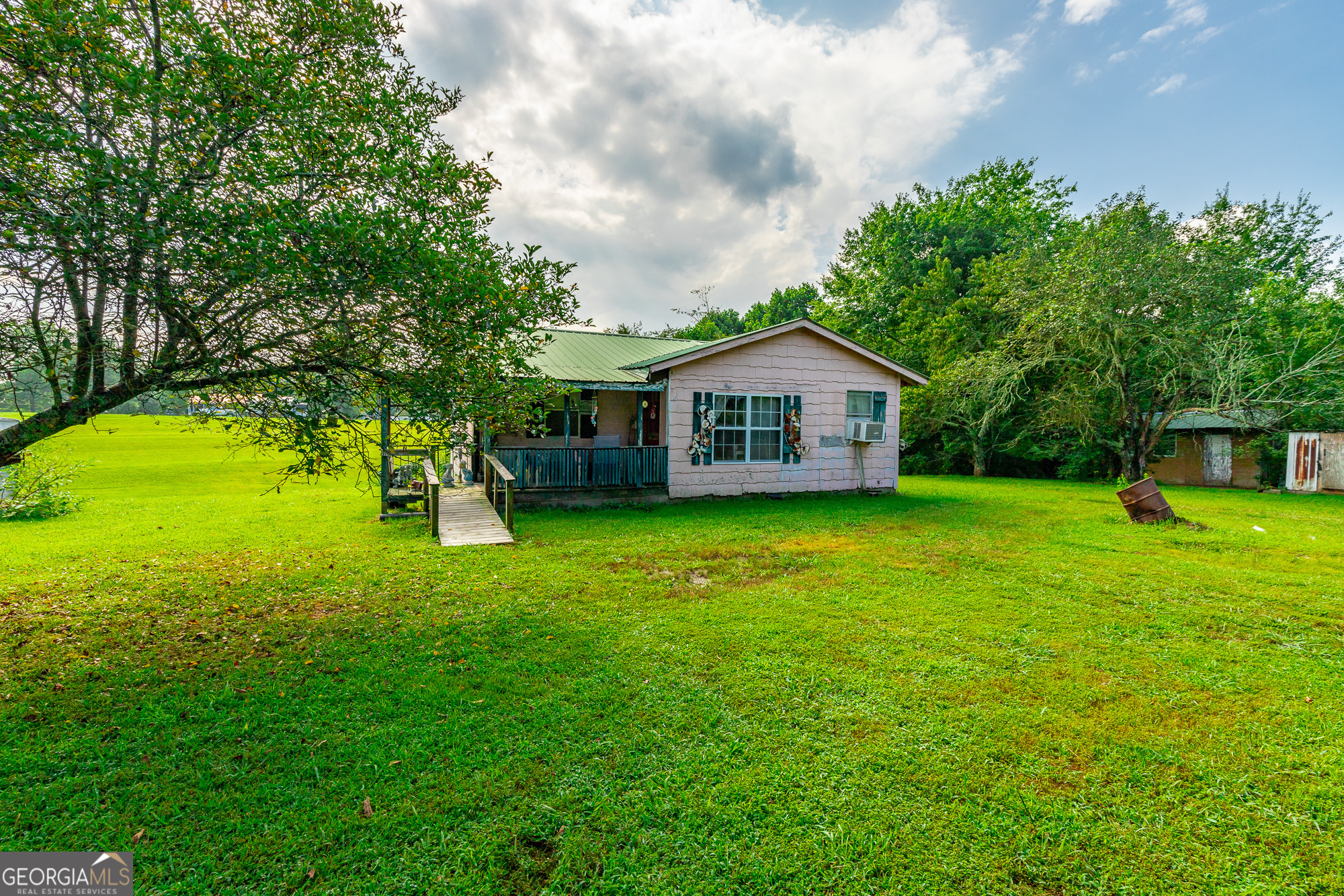 77 Bolton Road Trenton, GA 30752 - Photo 19 of 47 a house view with swimming pool in front of it
