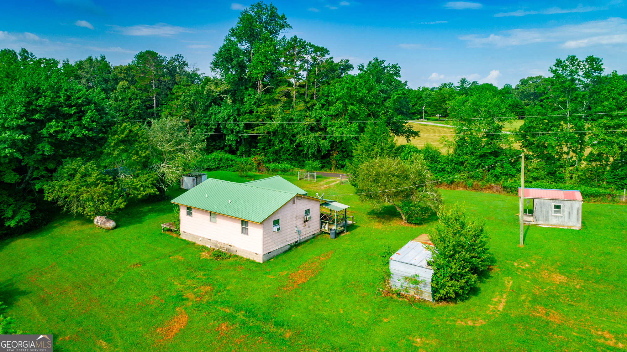 77 Bolton Road Trenton, GA 30752 - Photo 47 of 47 an aerial view of a house with a garden