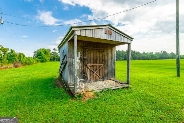 a view of a tiny house with a yard