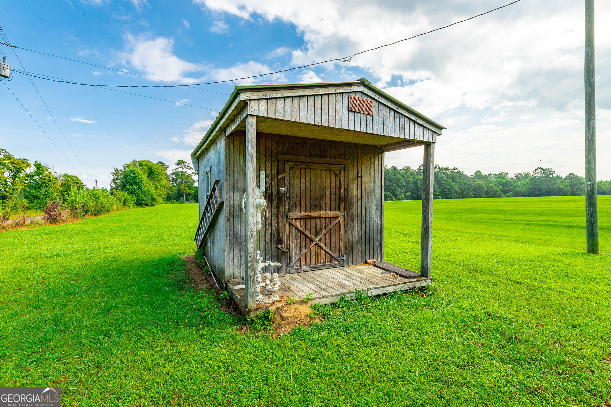 77 Bolton Road Trenton, GA 30752 - Photo 5 of 47 a view of a tiny house with a yard