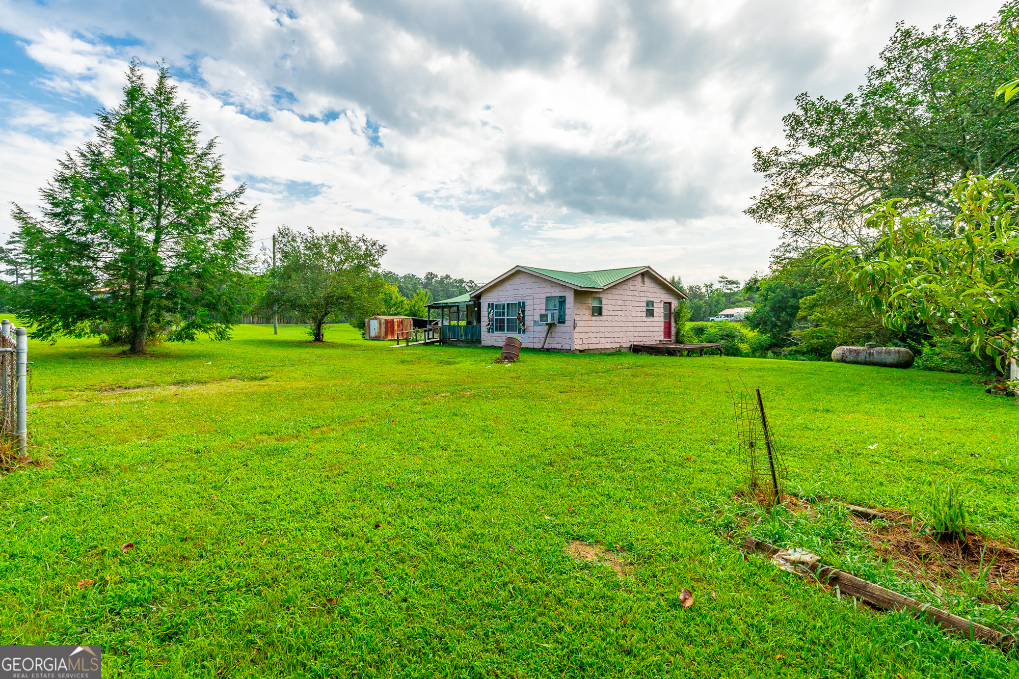 77 Bolton Road Trenton, GA 30752 - Photo 8 of 47 a view of a house with a big yard and large trees