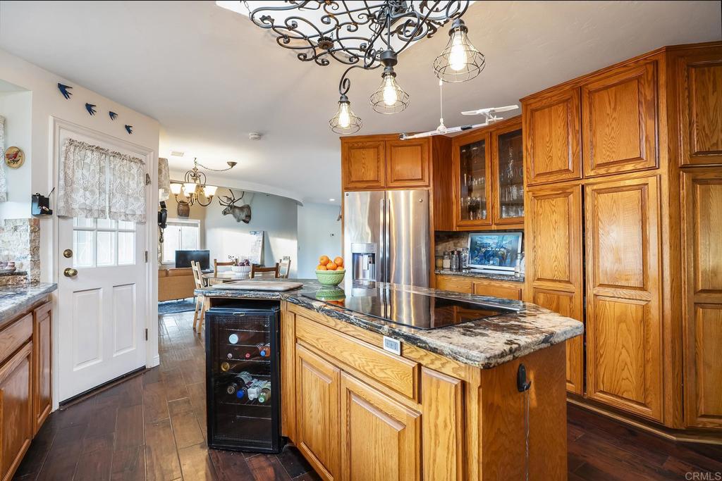 23002 Japatul Valley Road Alpine, CA 91901 - Photo 14 of 65 a kitchen with stainless steel appliances granite countertop a stove and a refrigerator