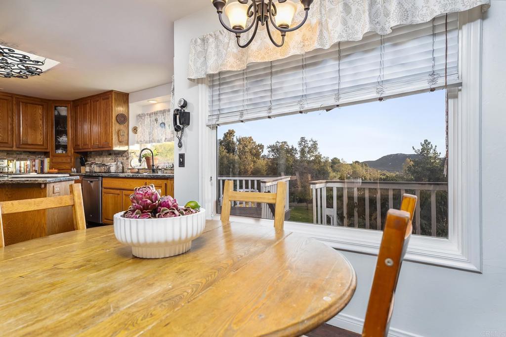 23002 Japatul Valley Road Alpine, CA 91901 - Photo 15 of 65 a view of a dining room with a table and chairs