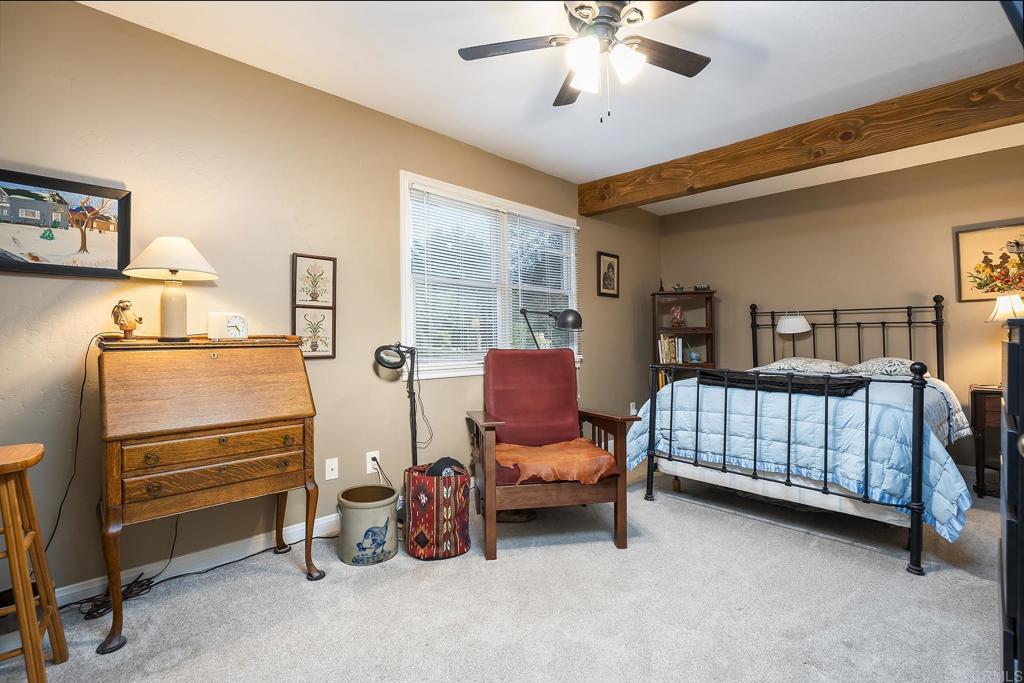 23002 Japatul Valley Road Alpine, CA 91901 - Photo 29 of 65 a bedroom with furniture and a window