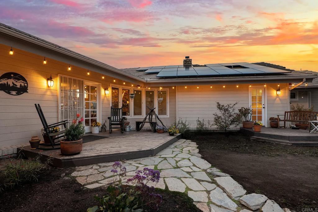 23002 Japatul Valley Road Alpine, CA 91901 - Photo 50 of 65 a view of a patio with table and chairs and potted plants