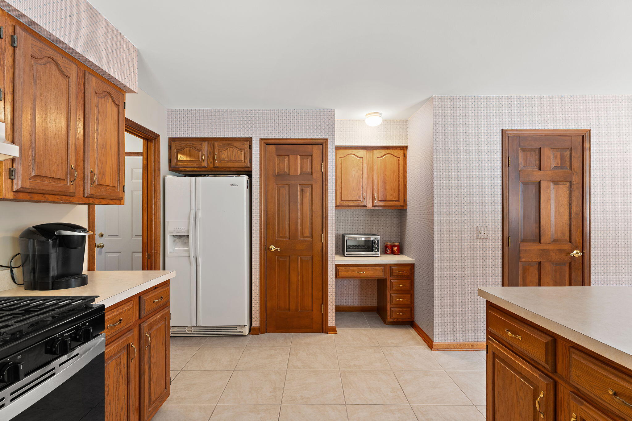 176 Wexford Road Valparaiso, IN 46385 - Photo 18 of 47 a kitchen with stainless steel appliances granite countertop a refrigerator and a stove top oven