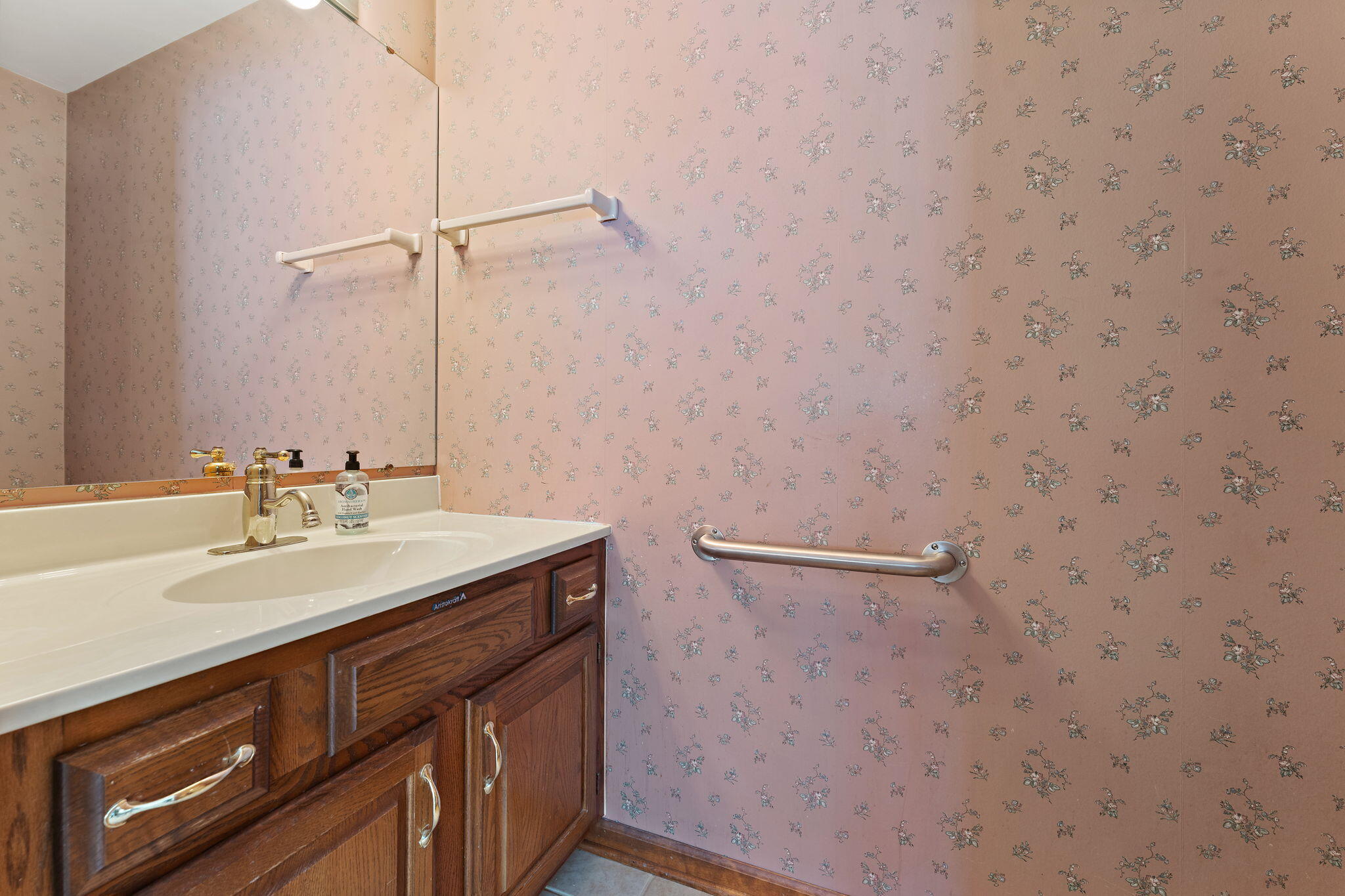 176 Wexford Road Valparaiso, IN 46385 - Photo 22 of 54 a bathroom with a sink a vanity and a mirror