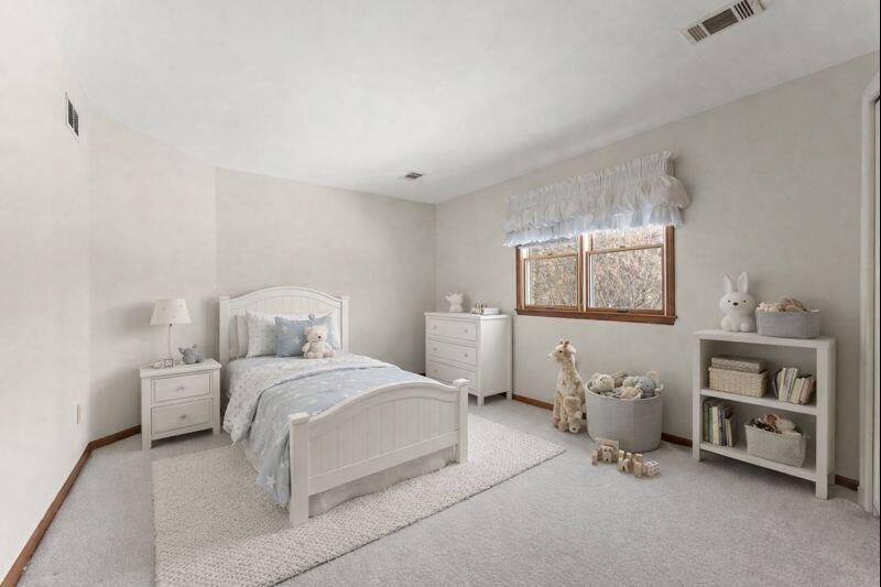 176 Wexford Road Valparaiso, IN 46385 - Photo 32 of 54 a bedroom with a bed and a lamp