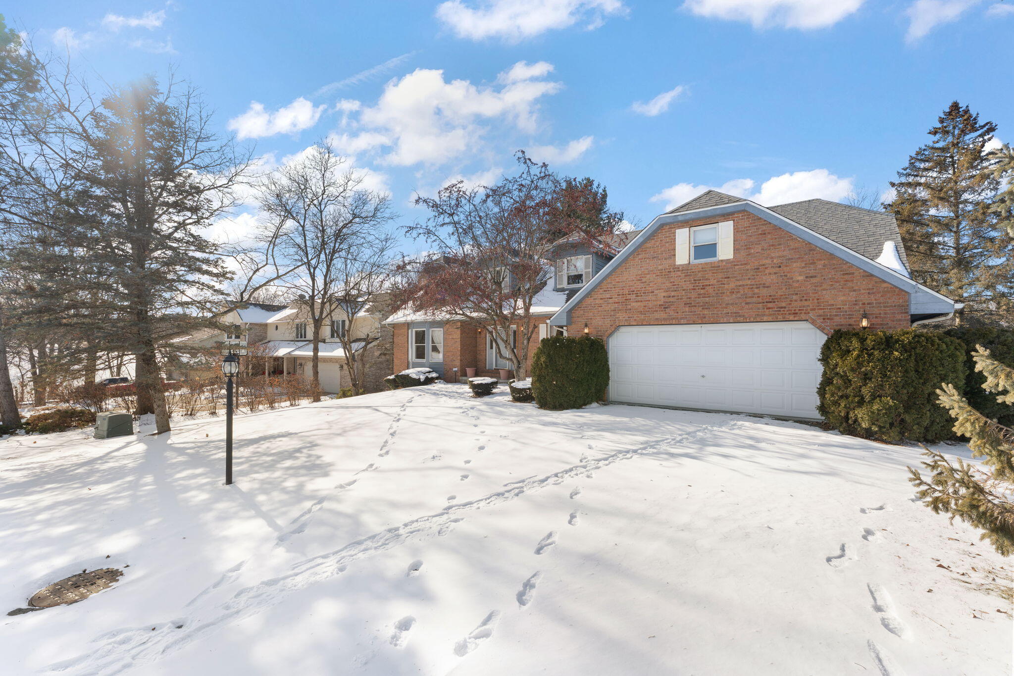 176 Wexford Road Valparaiso, IN 46385 - Photo 45 of 47 a front view of a house with a yard covered in snow