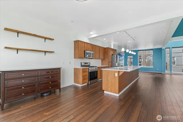 a view of kitchen and wooden floor