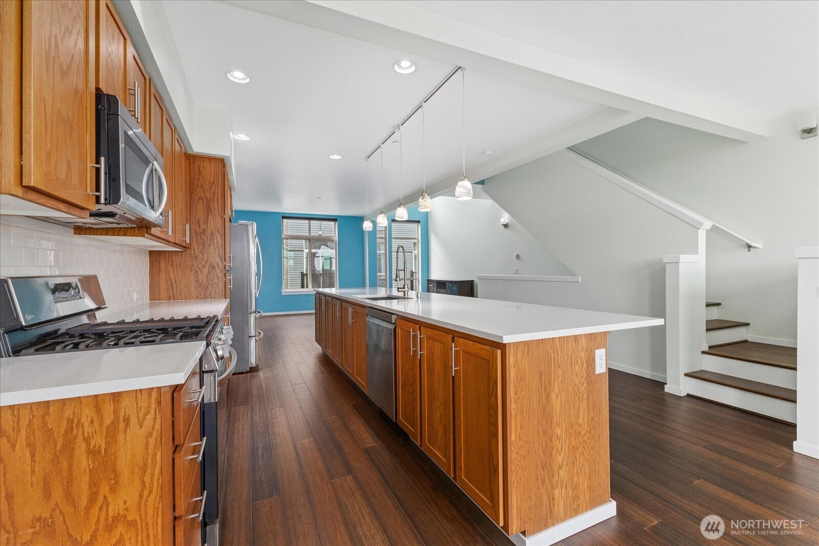 2132 South G Street Tacoma, WA 98405 - Photo 19 of 40 a kitchen with stainless steel appliances granite countertop lots of counter top space and wooden floor