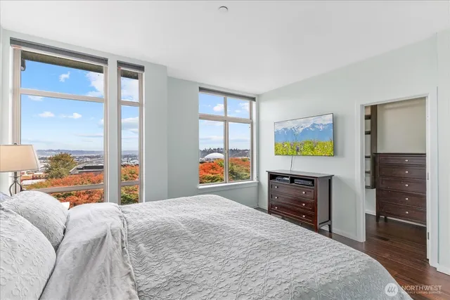 a bedroom with a bed and a dresser