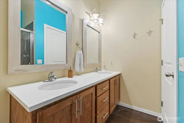 a bathroom with a sink vanity and a mirror