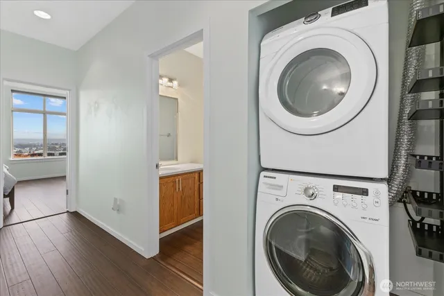 a view of a hallway with washer and dryer