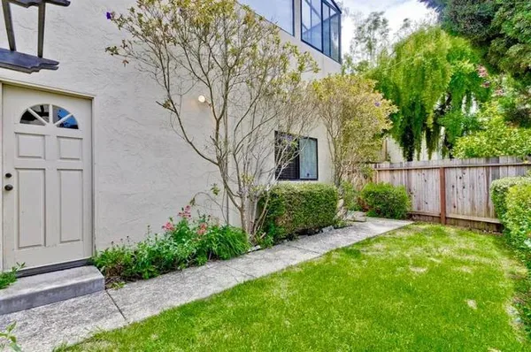 a view of a back yard of the house
