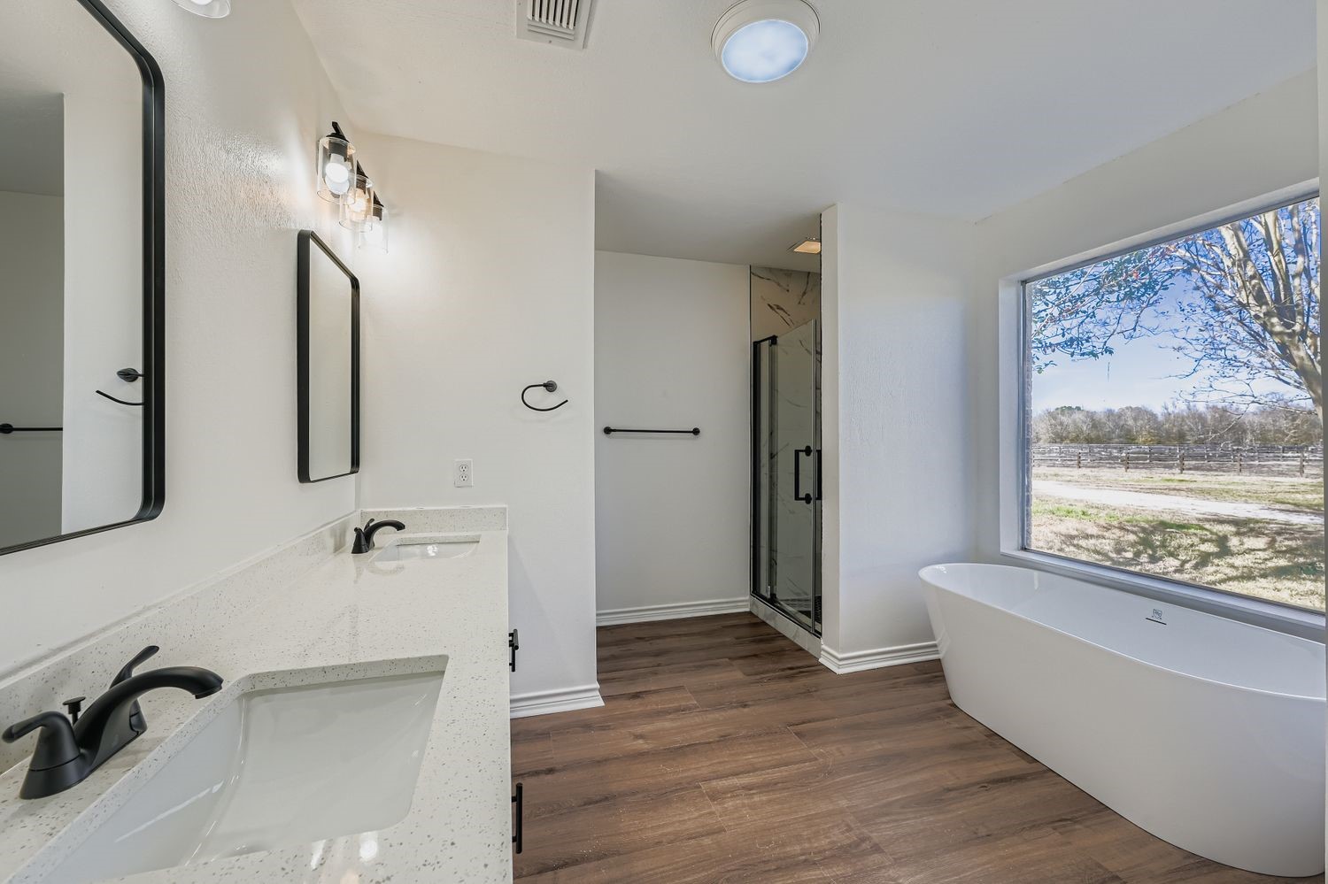 34411 Fulshear Farms Road Fulshear, TX 77441 - Photo 17 of 29 a bathroom with a bathtub and a window