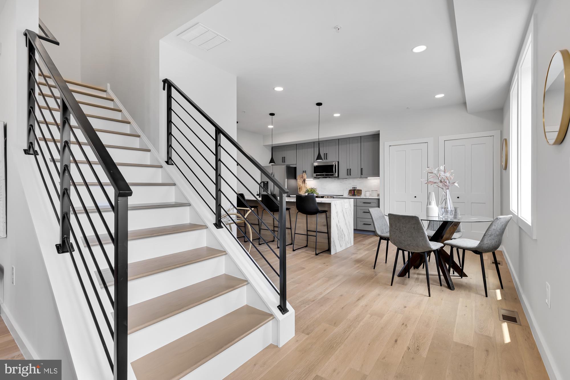 537 Park Road Northwest, Unit TH2 Washington, DC 20010 - Photo 14 of 60 a view of a dining room with furniture and wooden floor
