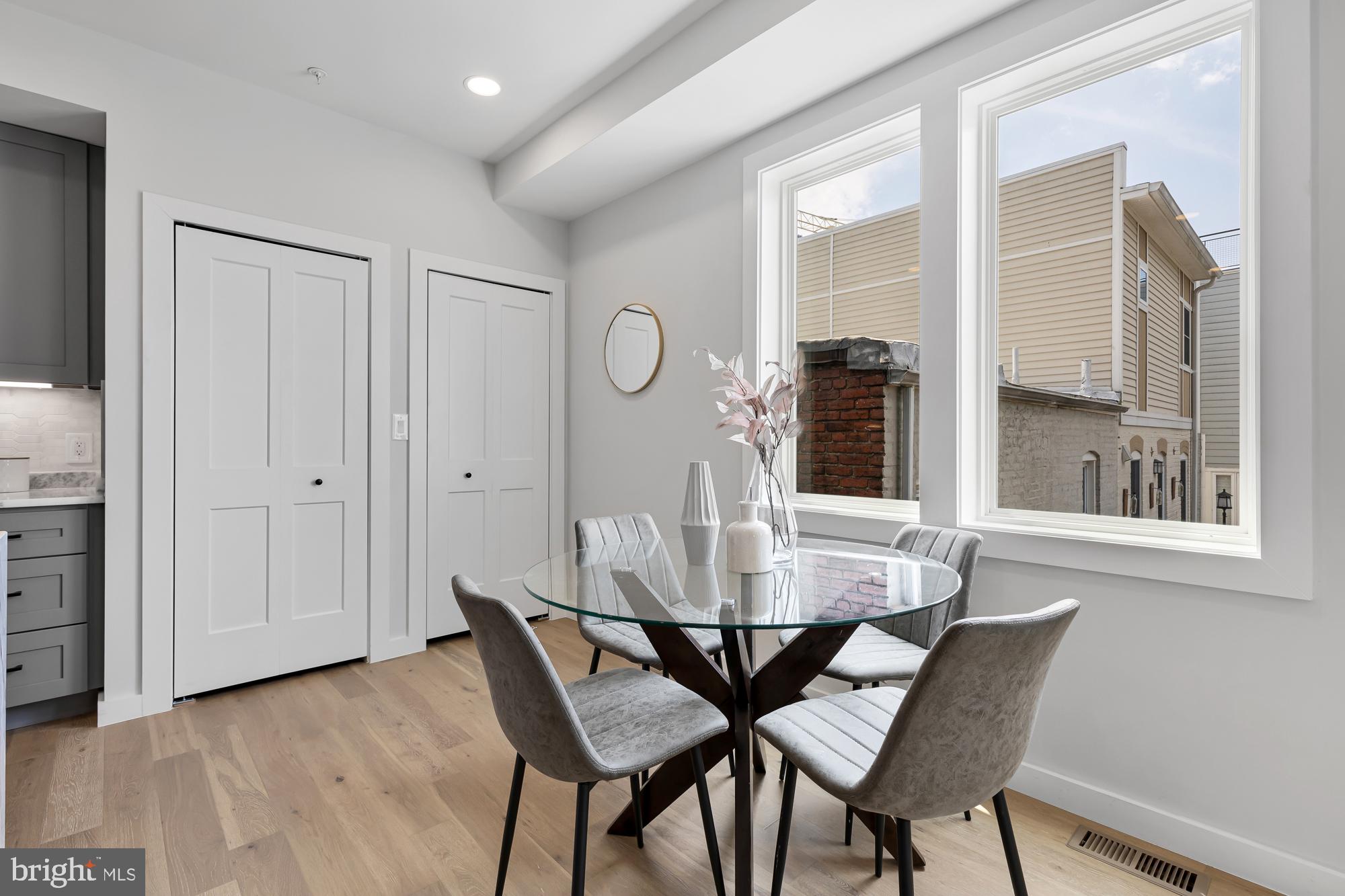 537 Park Road Northwest, Unit TH2 Washington, DC 20010 - Photo 22 of 60 a view of a dining room with furniture and window