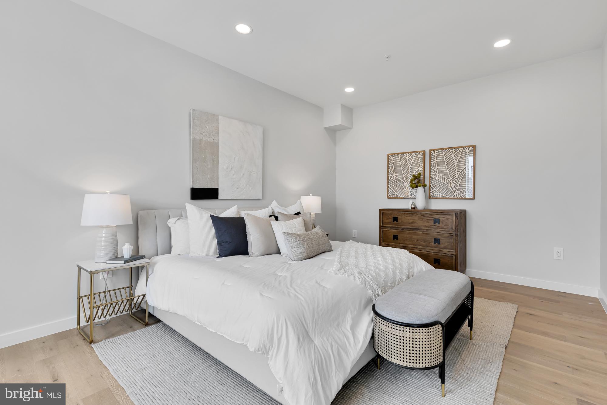 537 Park Road Northwest, Unit TH2 Washington, DC 20010 - Photo 24 of 60 a bedroom with a bed and a lamp