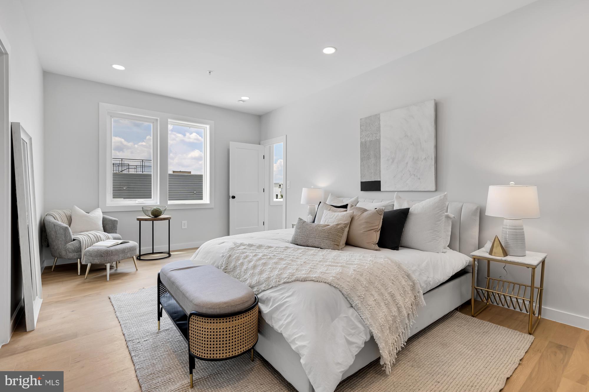 537 Park Road Northwest, Unit TH2 Washington, DC 20010 - Photo 25 of 60 a spacious bedroom with a bed and wooden floor