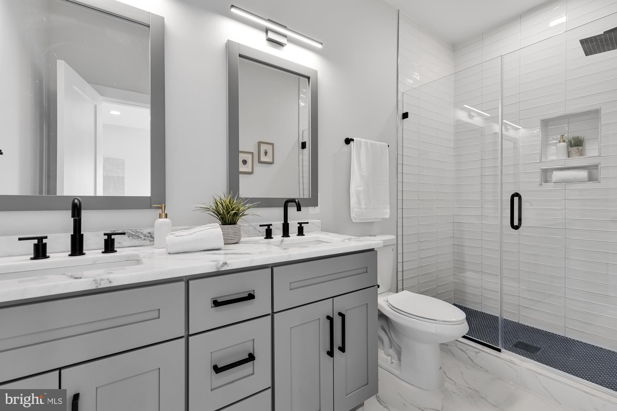 537 Park Road Northwest, Unit TH2 Washington, DC 20010 - Photo 28 of 60 a bathroom with a toilet sink a shower and