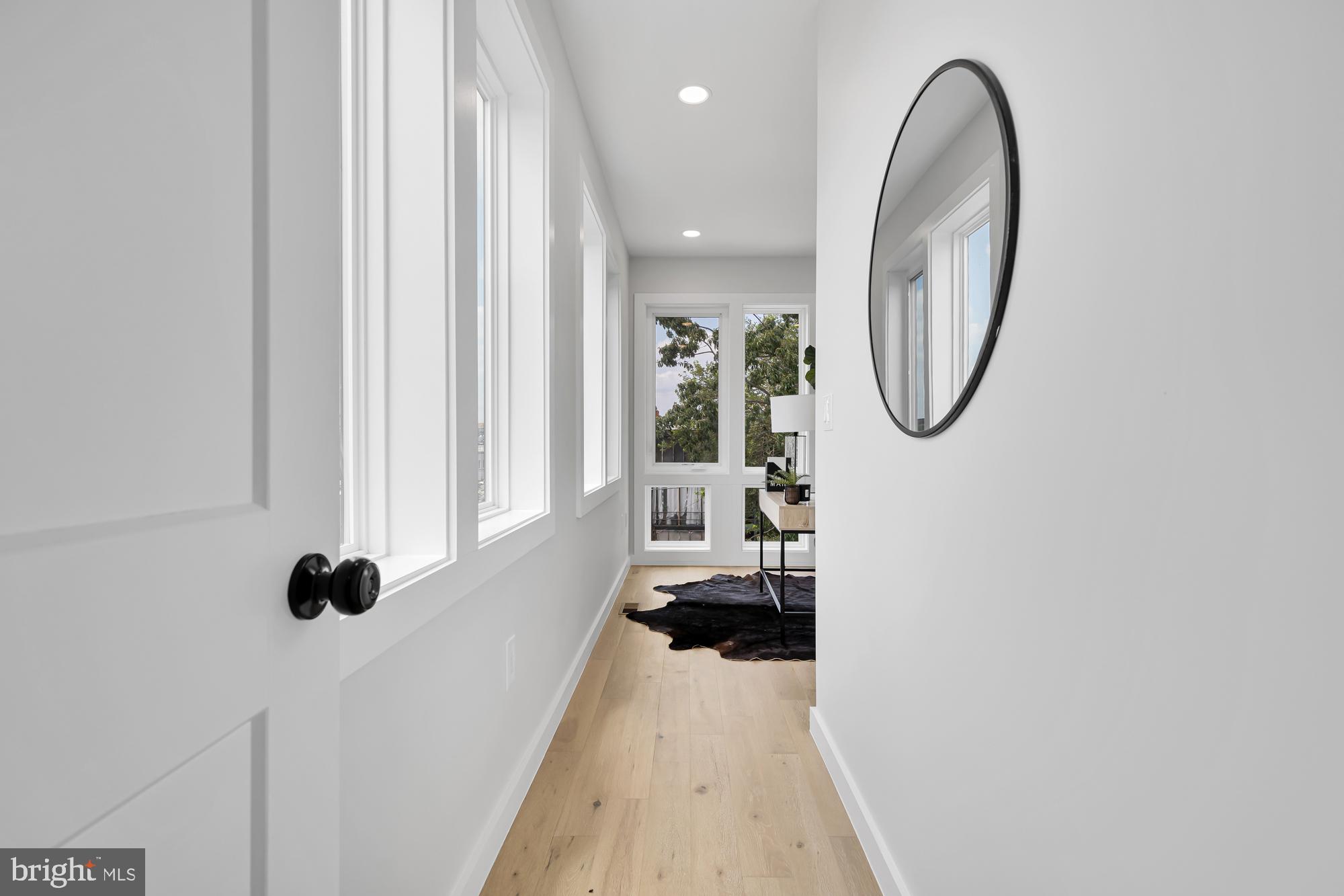 537 Park Road Northwest, Unit TH2 Washington, DC 20010 - Photo 34 of 60 an entryway in a house with a mirror