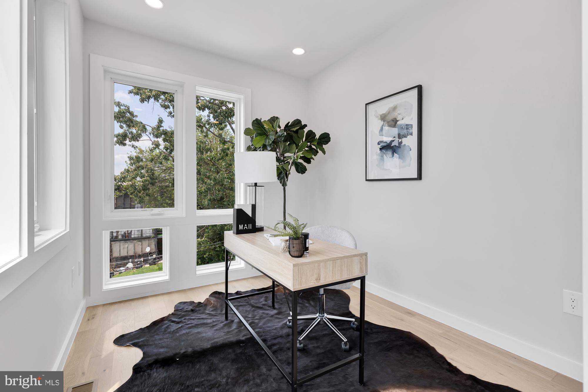 537 Park Road Northwest, Unit TH2 Washington, DC 20010 - Photo 35 of 60 a living room with furniture and a window